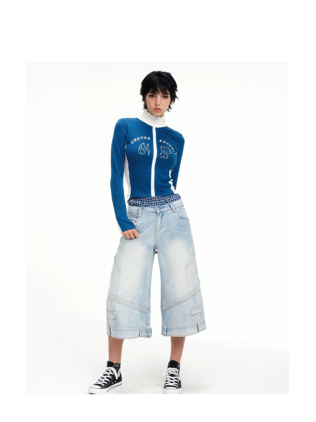 Front white-background view of the light-wash layered-waist cropped jeans