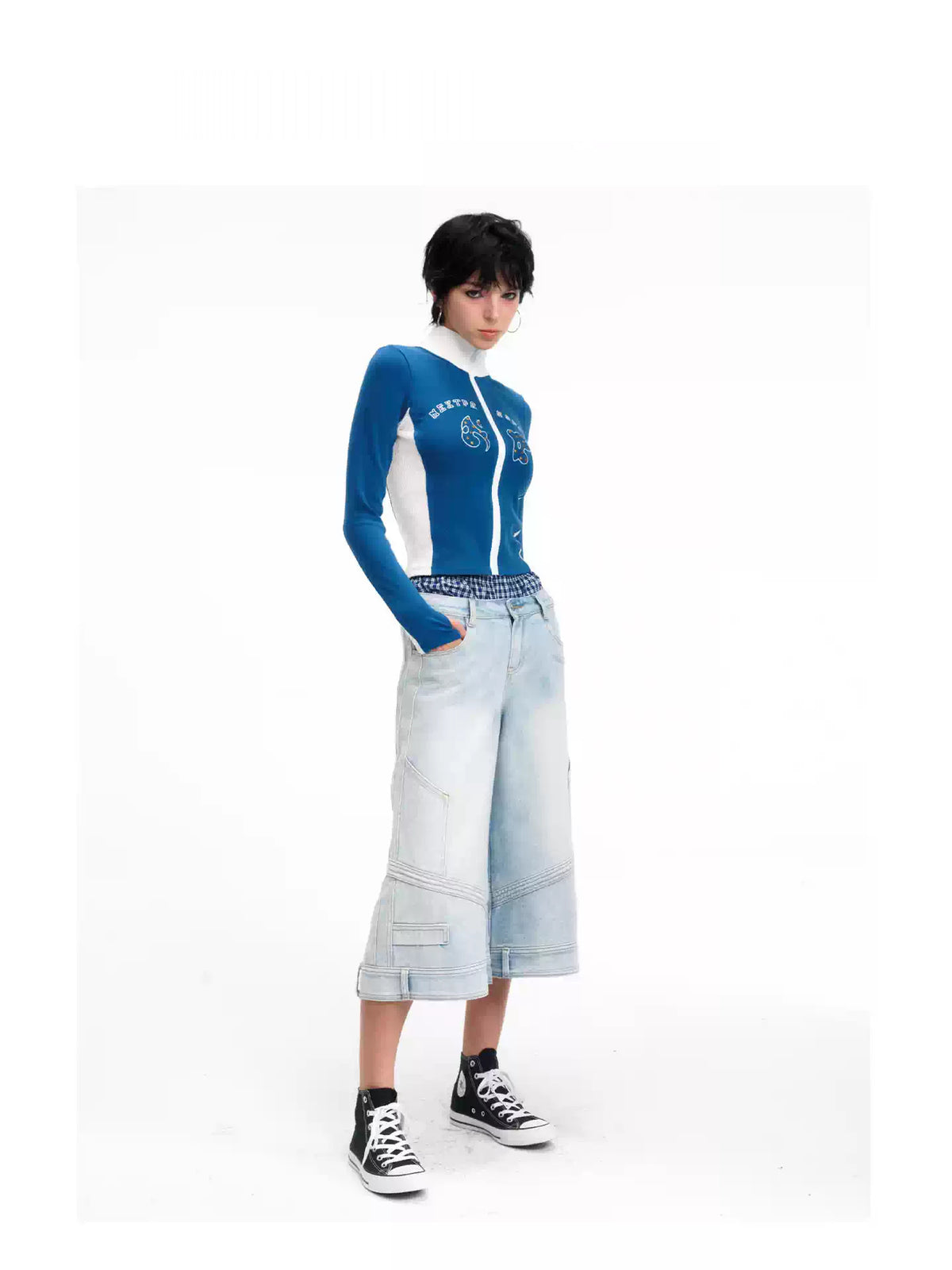 Three-quarter modeled view of the light-blue cropped wide-leg jeans