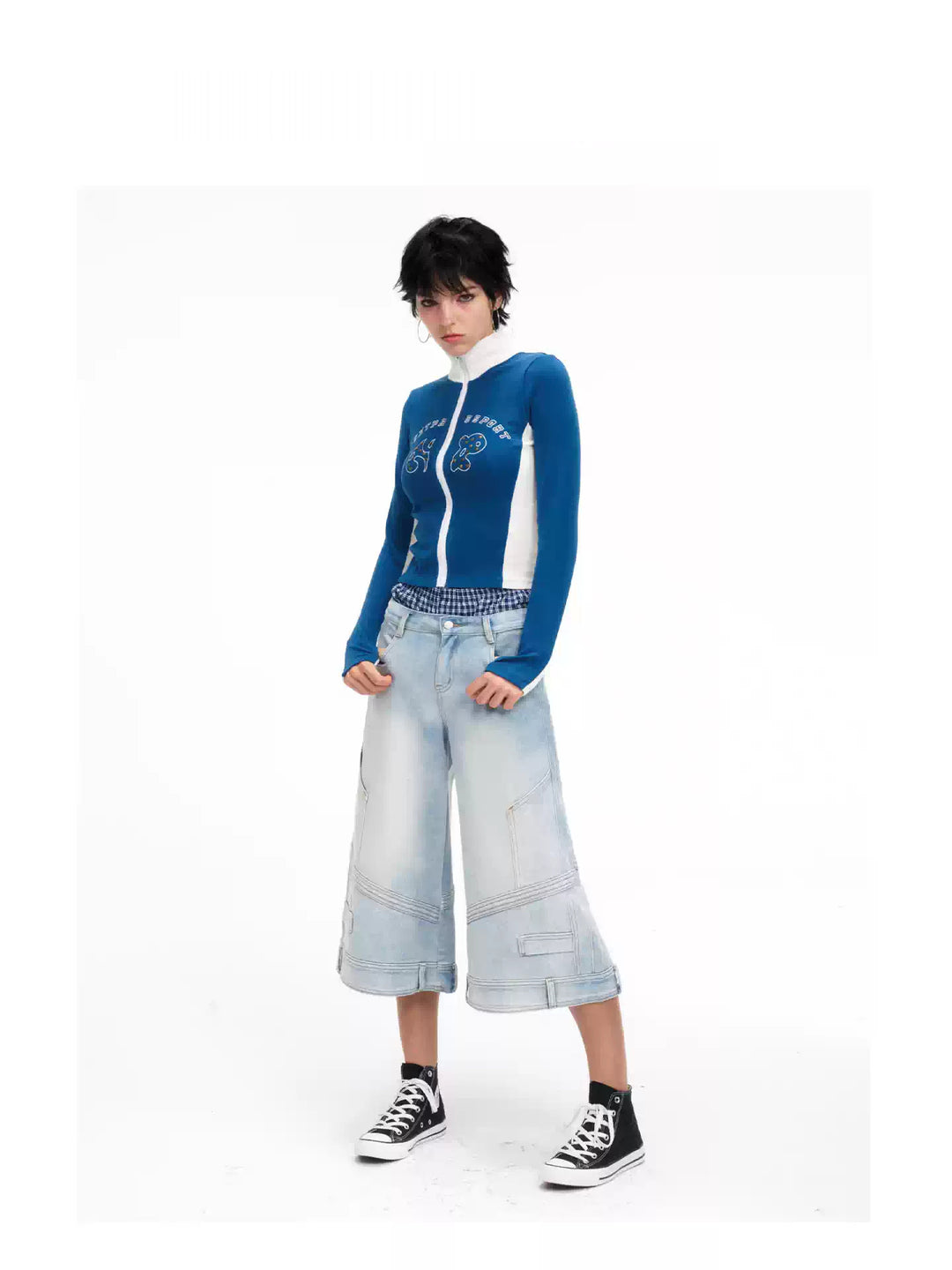 Front angled modeled view of the light-wash cropped jeans