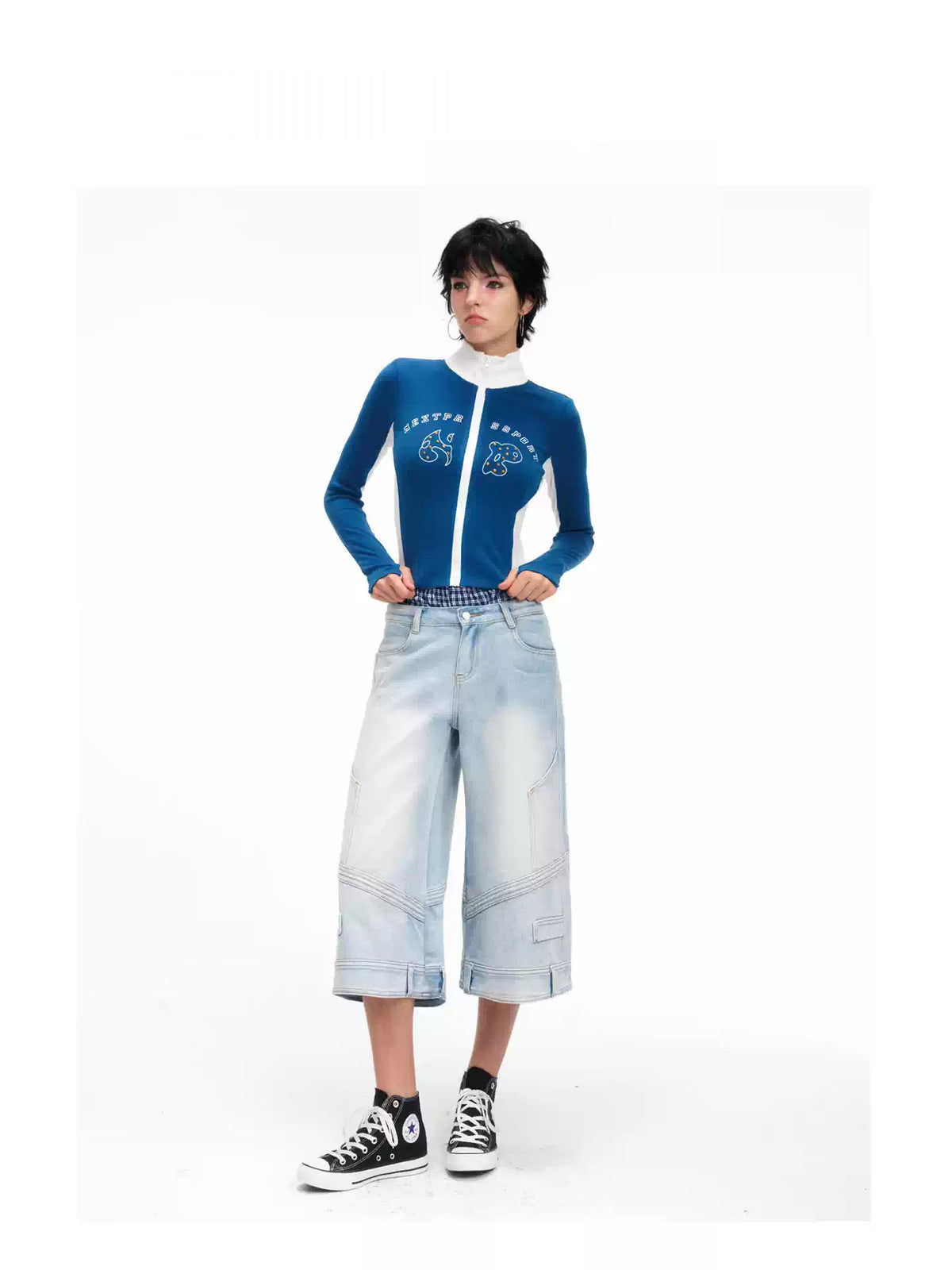 Straight-on modeled view of the light-blue wide-leg cropped jeans