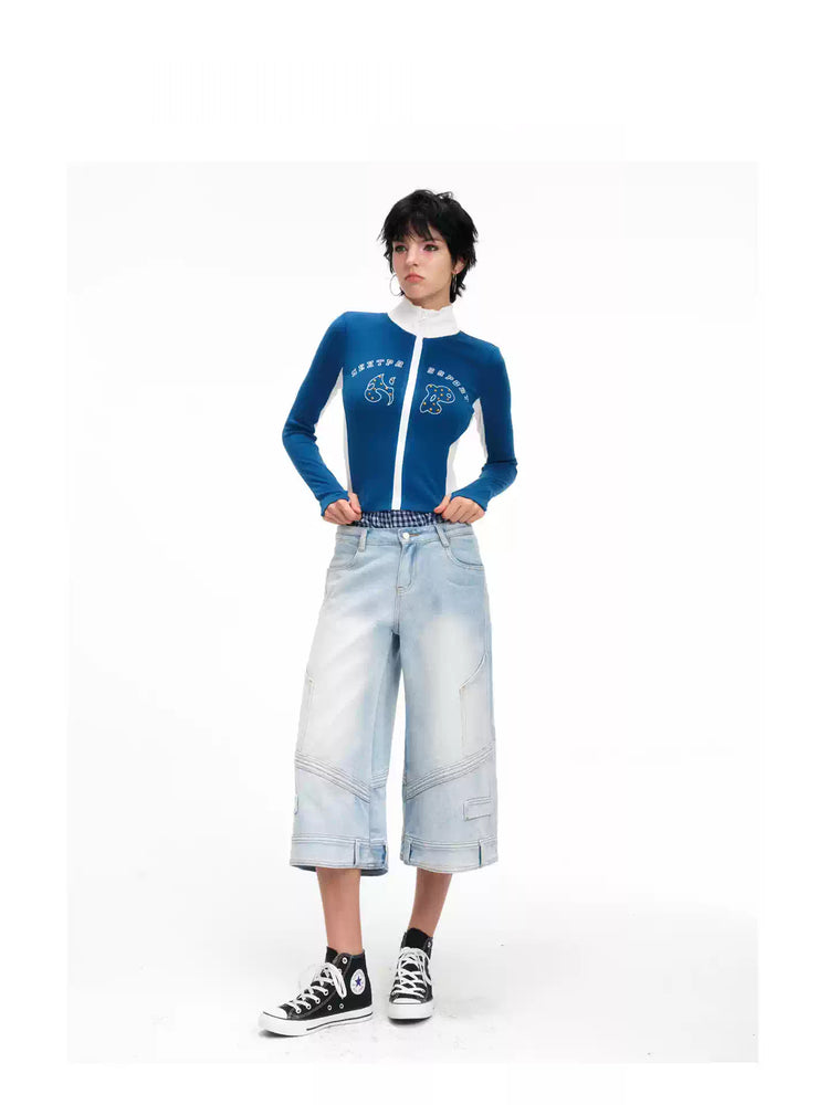 Straight-on modeled view of the light-blue wide-leg cropped jeans