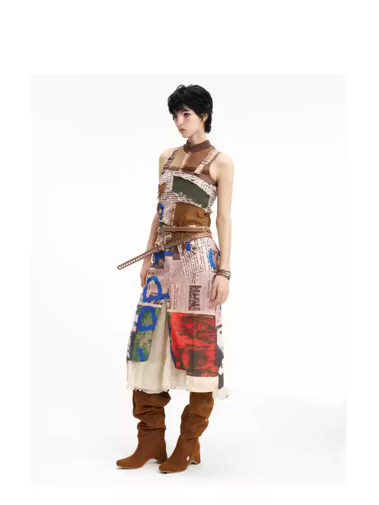 NEXT PASSPORT newspaper-print slit suspender dress — front three-quarter full-length view.