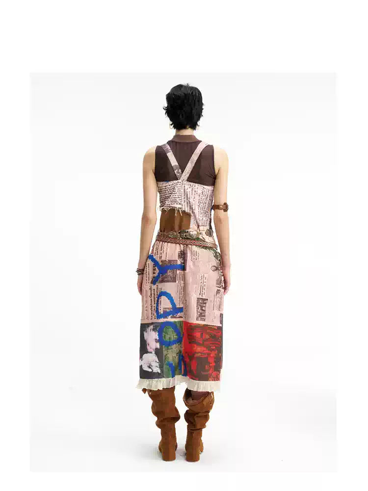 NEXT PASSPORT newspaper-print slit suspender dress — back full-length view.