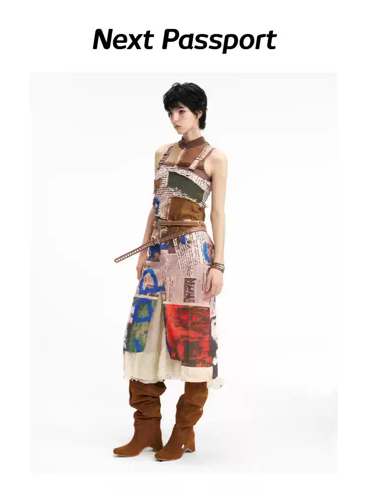 NEXT PASSPORT newspaper-print slit suspender dress — front three-quarter full-length view.