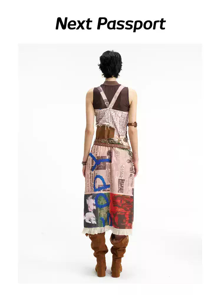 NEXT PASSPORT newspaper-print slit suspender dress — back full-length view.