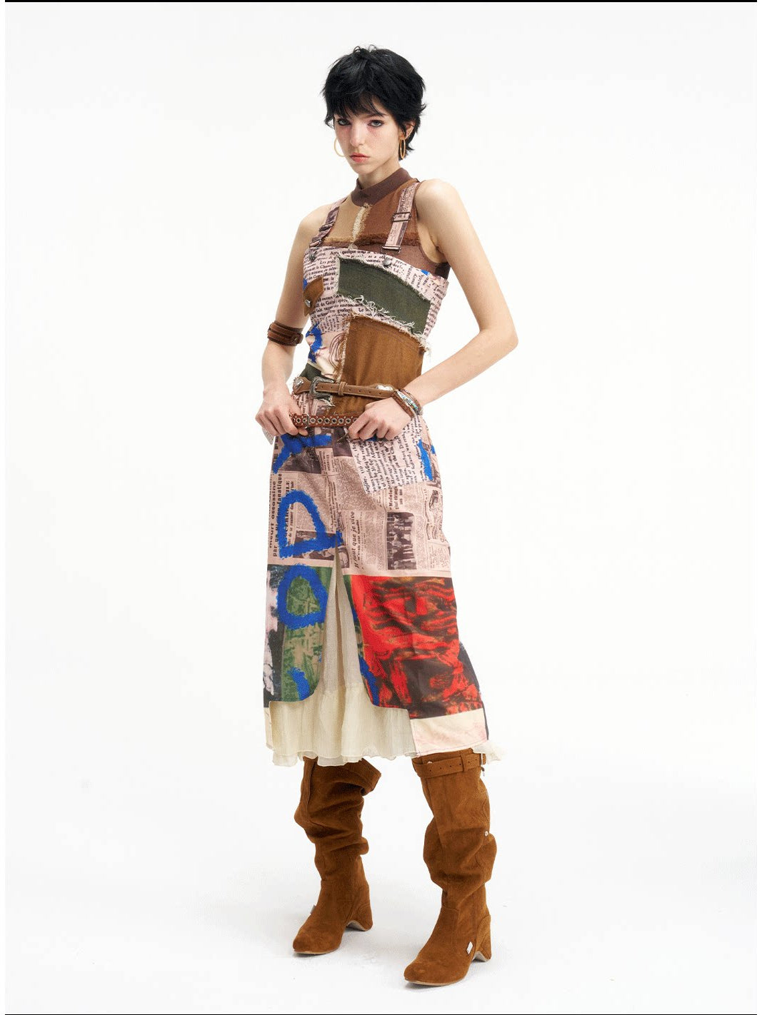 NEXT PASSPORT newspaper-print slit suspender dress — alternate front three-quarter view.