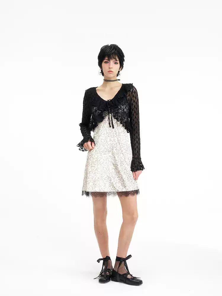 NEXT PASSPORT black lace cropped cardigan — front view layered over a white dress.