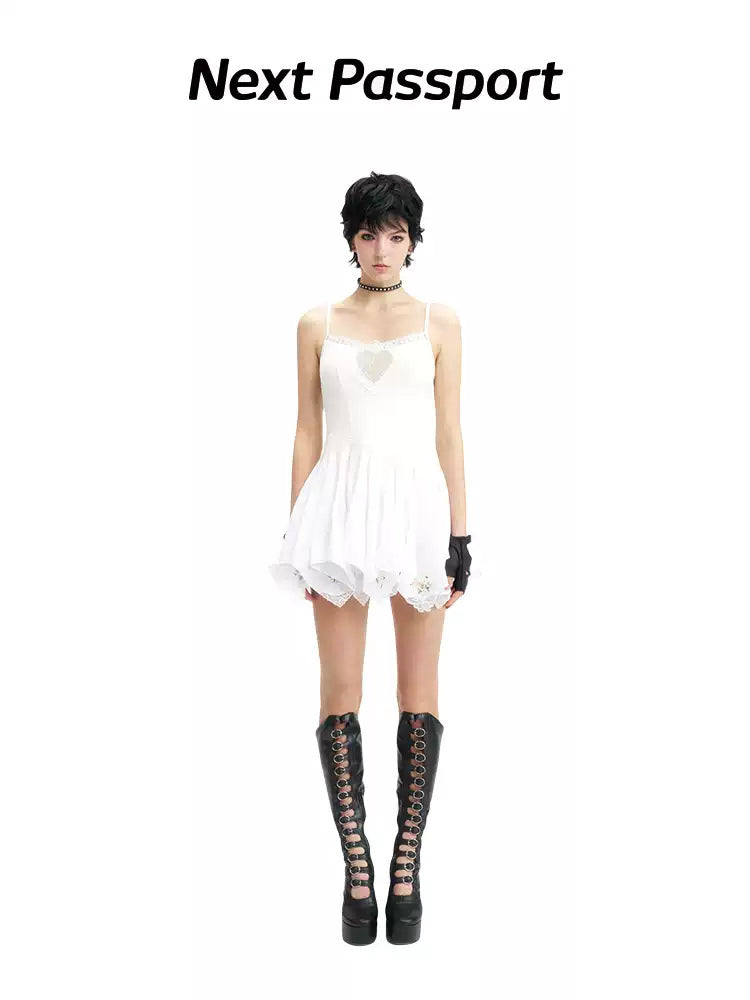 NEXT PASSPORT swan-embroidered lace ballet dress in ivory — short camisole-length front studio view.