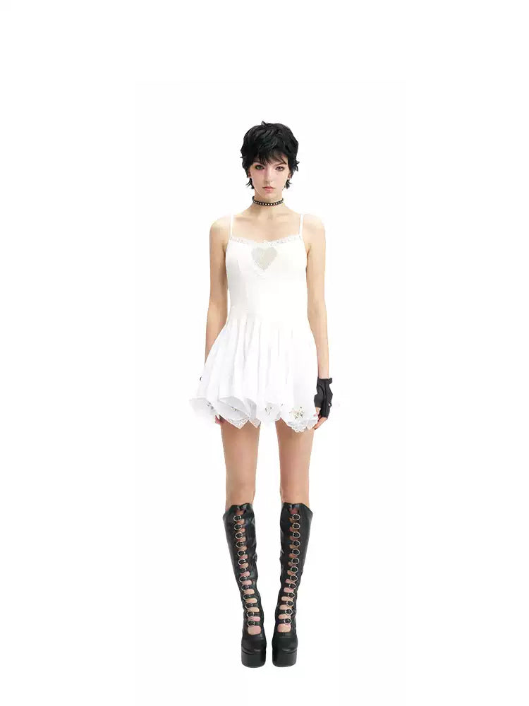NEXT PASSPORT swan-embroidered lace ballet dress in ivory — short camisole-length front studio view.