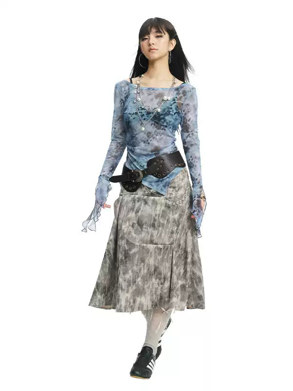 NEXT PASSPORT gray crinkled-print midi skirt modeled in a three-quarter front view.
