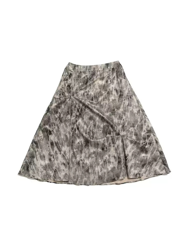 NEXT PASSPORT gray crinkled-print midi skirt studio front view with lace-up boots.
