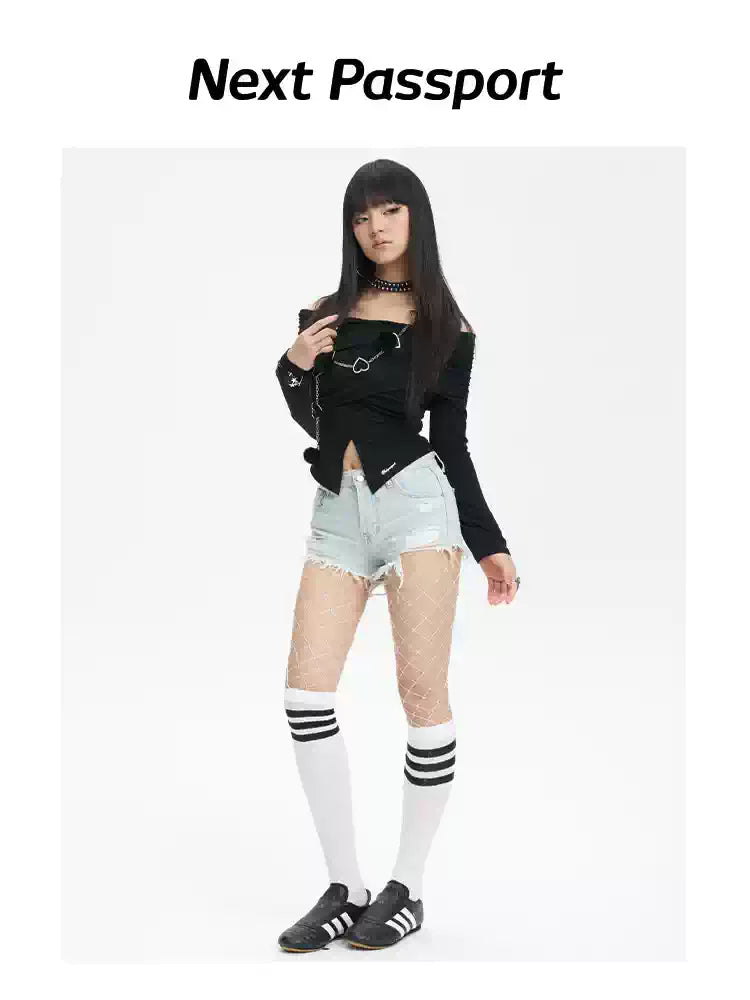 NEXT PASSPORT distressed fringe denim shorts in denim blue — full-length three-quarter modeled view with striped knee socks.