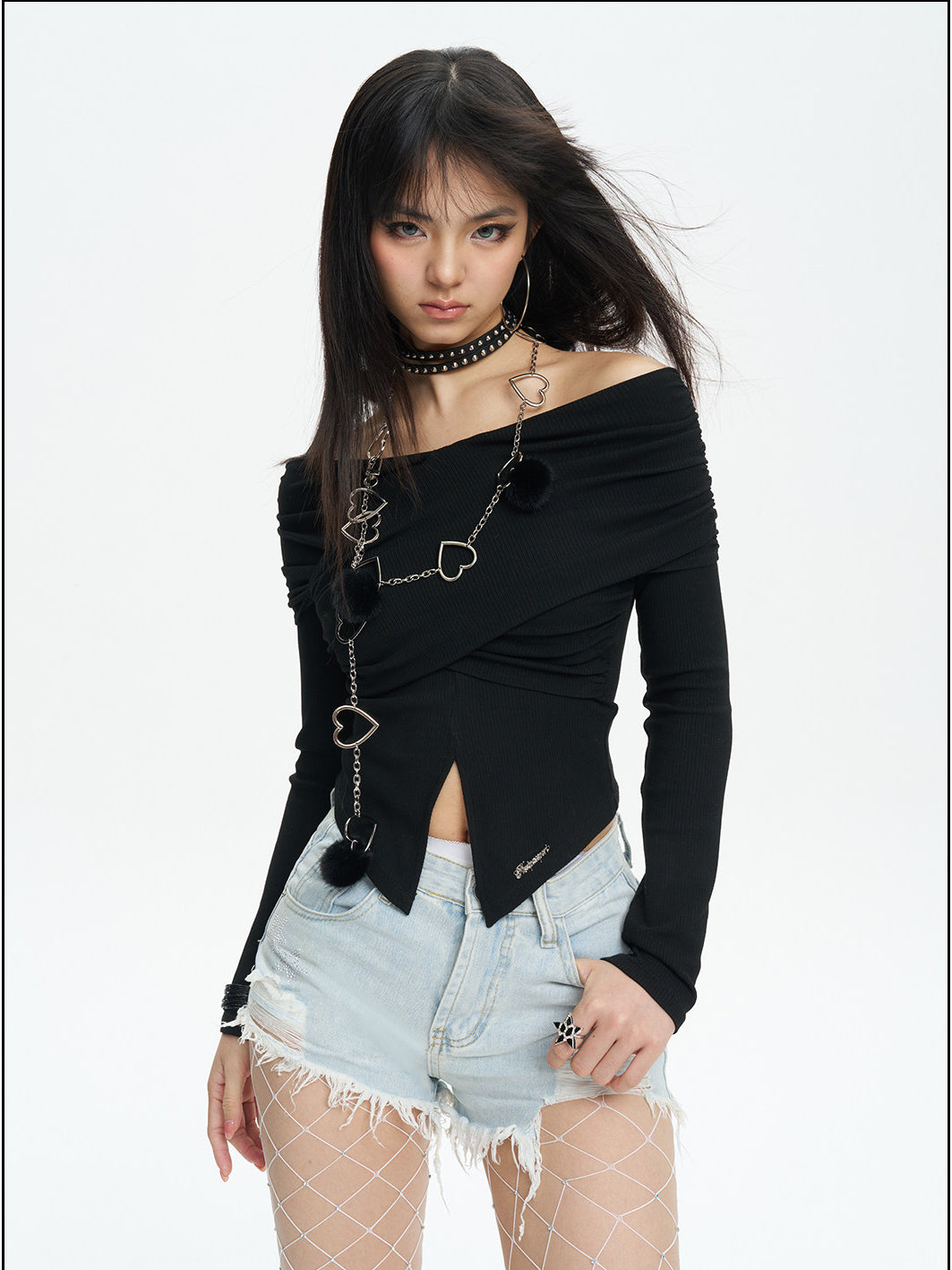 NEXT PASSPORT distressed fringe denim shorts in denim blue — front three-quarter studio modeled view.