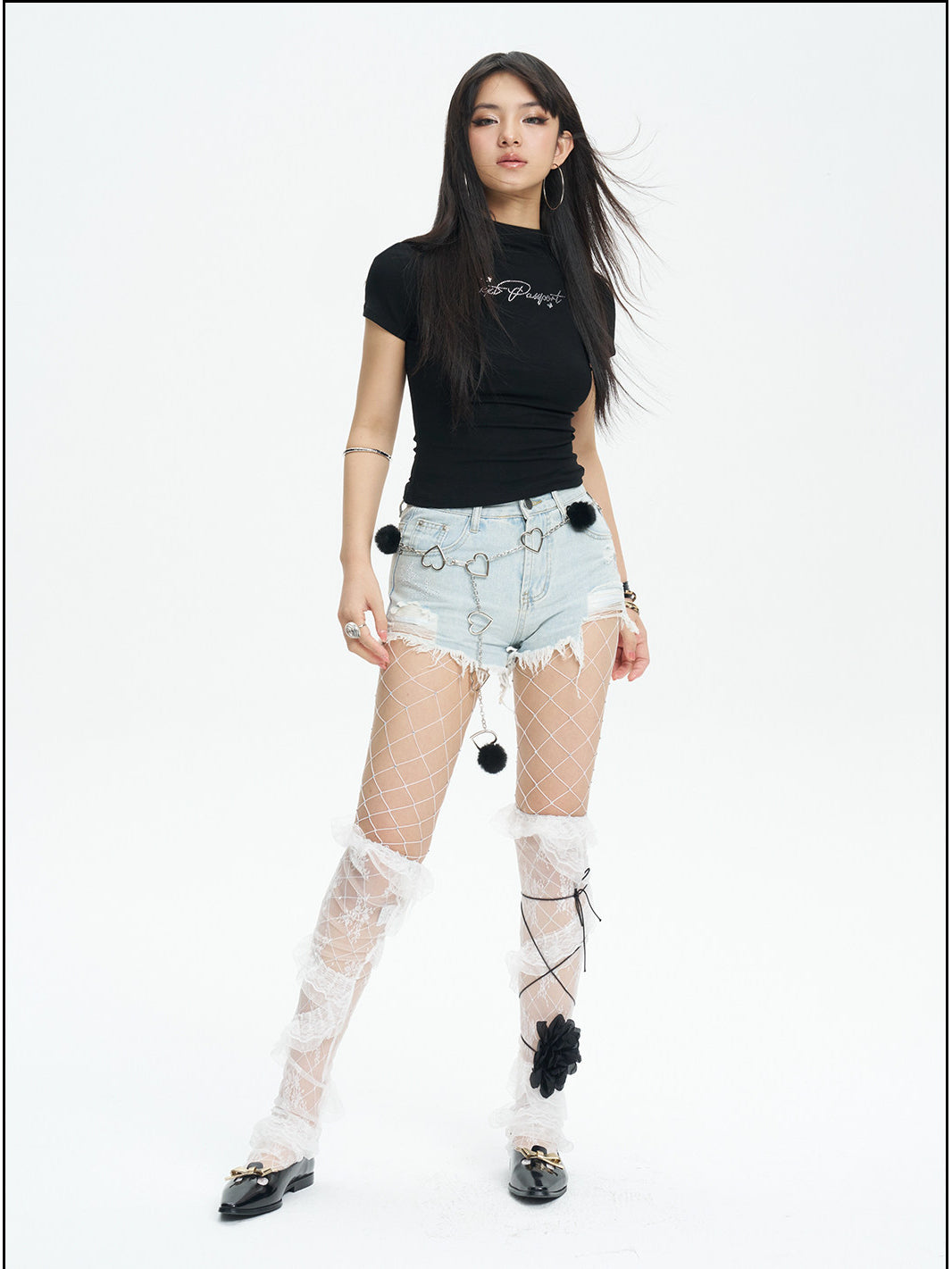 NEXT PASSPORT distressed fringe denim shorts in denim blue — full-length studio modeled view.