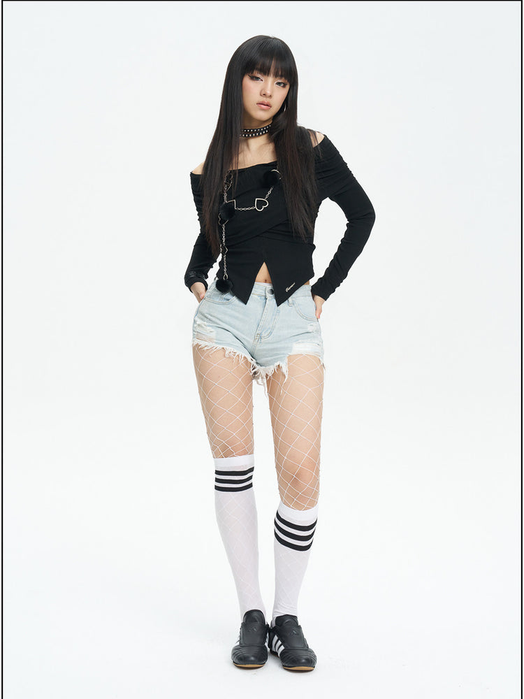 NEXT PASSPORT distressed fringe denim shorts in denim blue — straight-on modeled view with hands in the pockets.