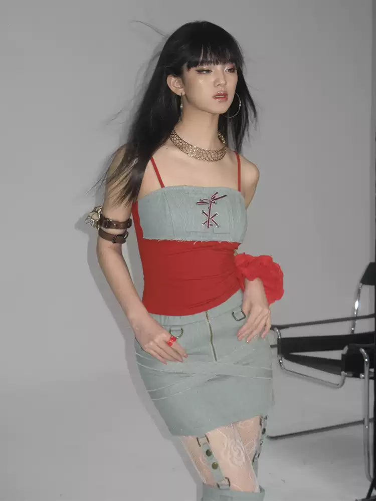NEXT PASSPORT lace-up denim-panel camisole in red and pale denim blue — three-quarter gray studio view.