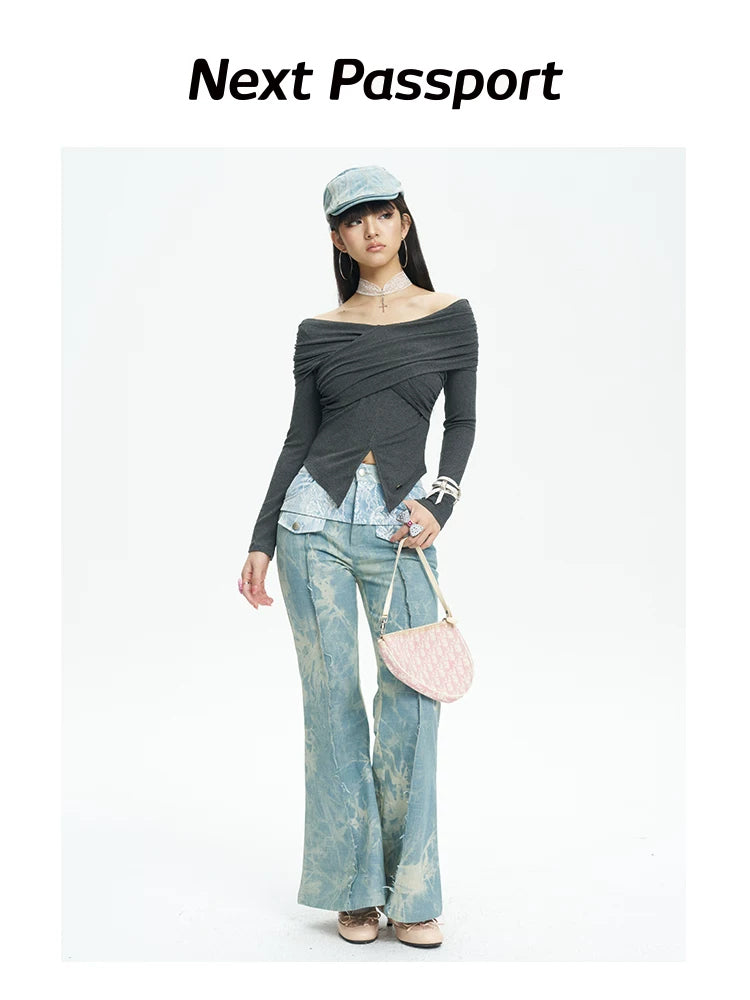 NEXT PASSPORT printed lace-panel flared jeans in pale blue — full-length front modeled view with black top.