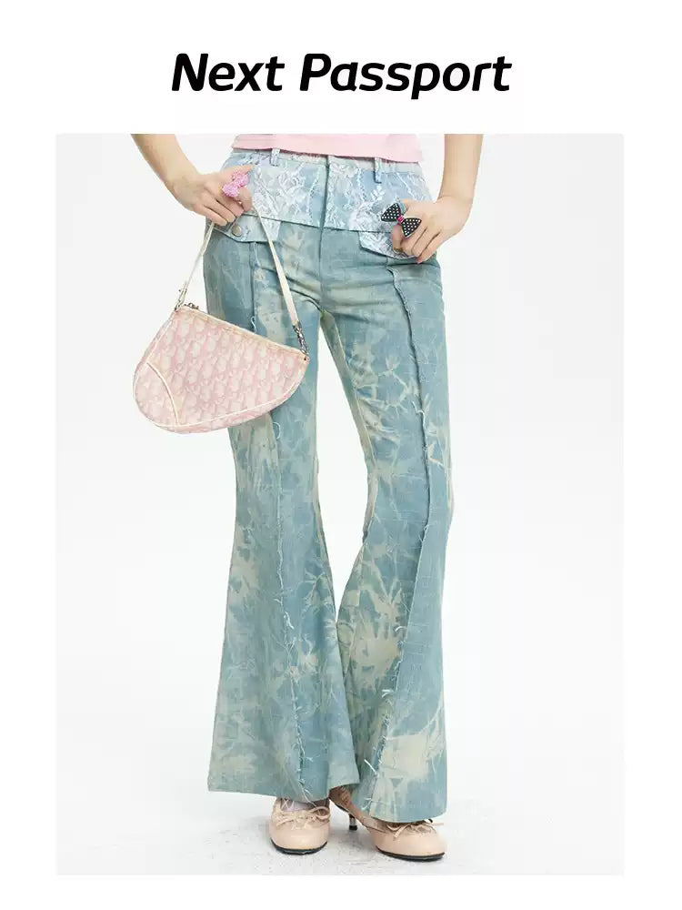 NEXT PASSPORT printed lace-panel flared jeans in pale blue — close front modeled view with pink top.