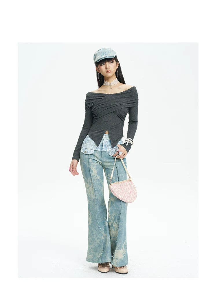 NEXT PASSPORT printed lace-panel flared jeans in pale blue — full-length front modeled view with black top.