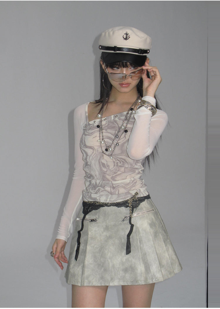 NEXT PASSPORT light-gray tie-dye curved-sleeve PU jacket with matching pleated skirt, close styled view