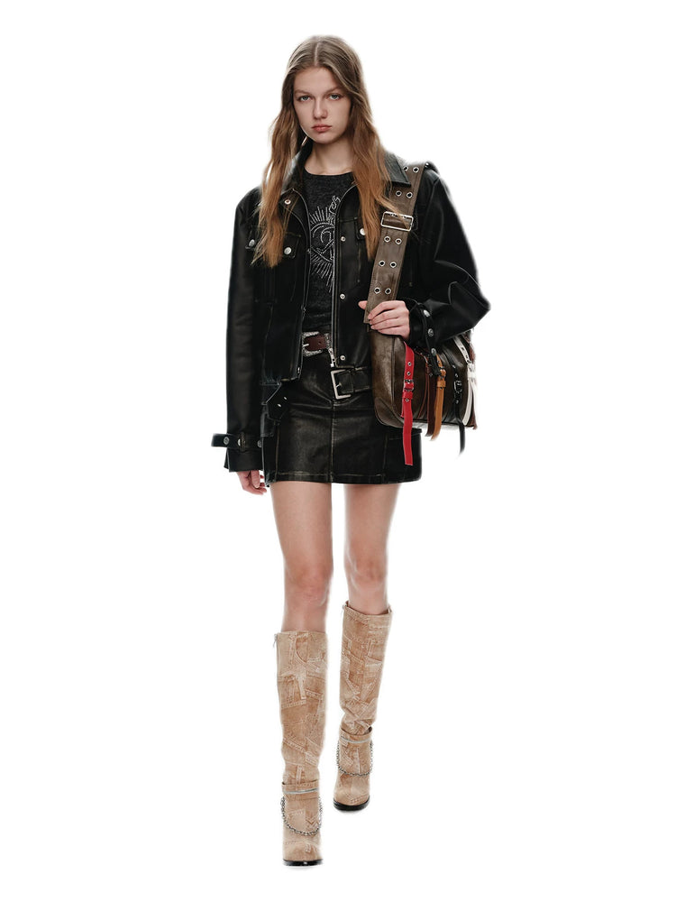NEXT PASSPORT distressed black PU jacket and cargo-pocket mini skirt set, walking view
