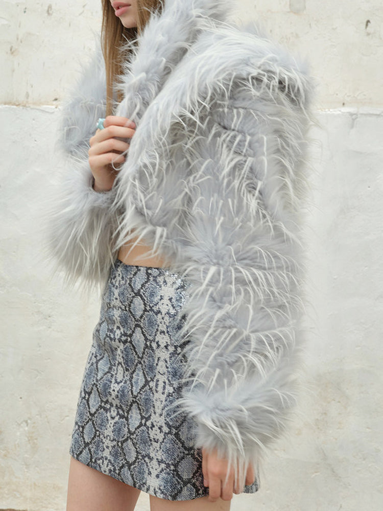 NEXT PASSPORT icy-blue long-pile faux-fur cropped jacket — front pile and sleeve construction detail.