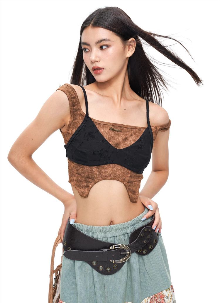 NEXT PASSPORT wasteland-brown shark-pleat vest and mini skirt — editorial full-length view