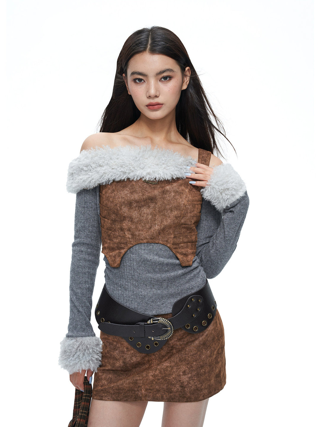 NEXT PASSPORT wasteland-brown shark-pleat vest and mini skirt — front modeled studio view