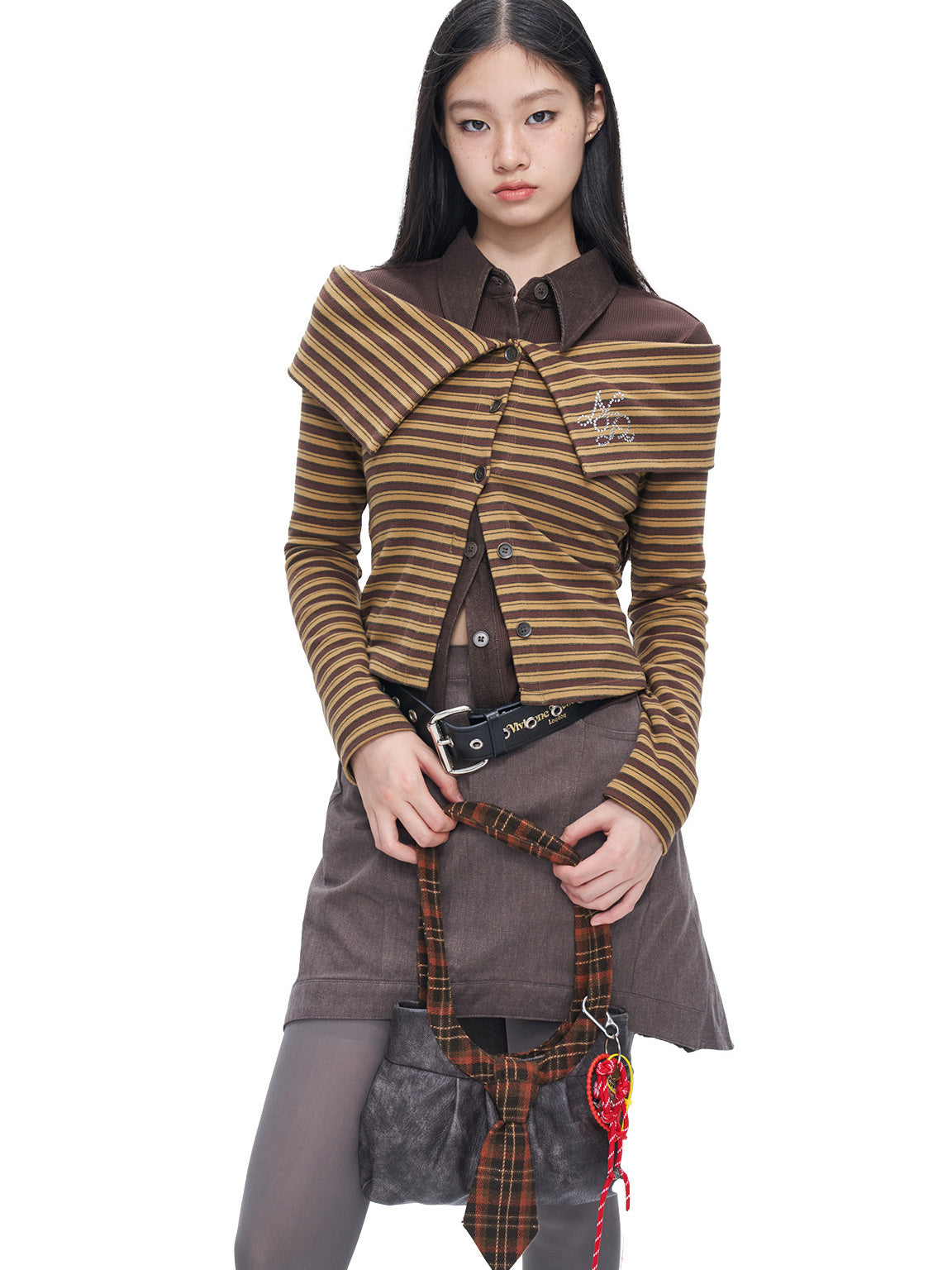 Three-quarter studio view of the NEXT PASSPORT brown-yellow striped wide-collar off-shoulder cardigan