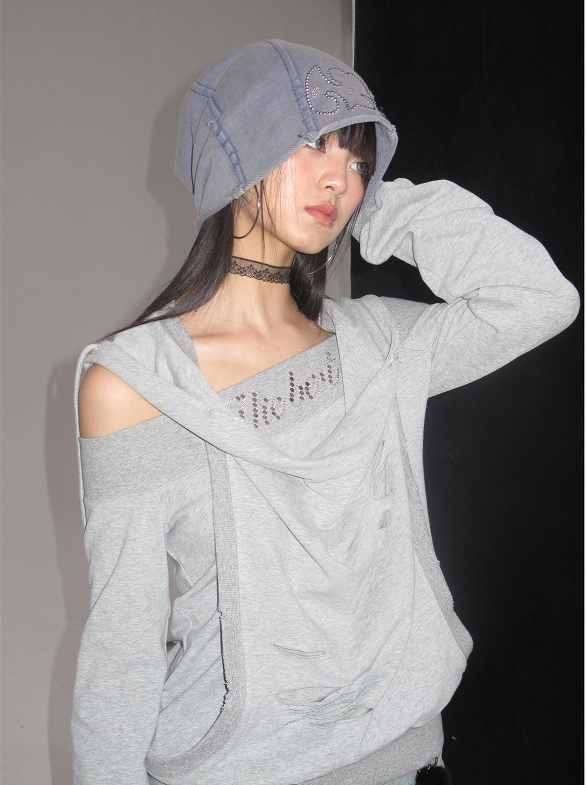 NEXT PASSPORT washed rhinestone blue-gray slouch beanie — front modeled flash-lit view