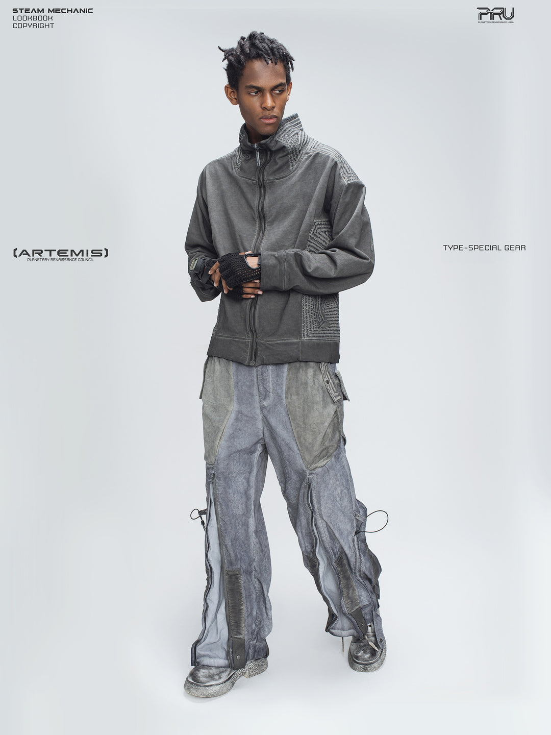 STARCORE moon dust gray engineer utility pants — full front modeled view with hands clasped
