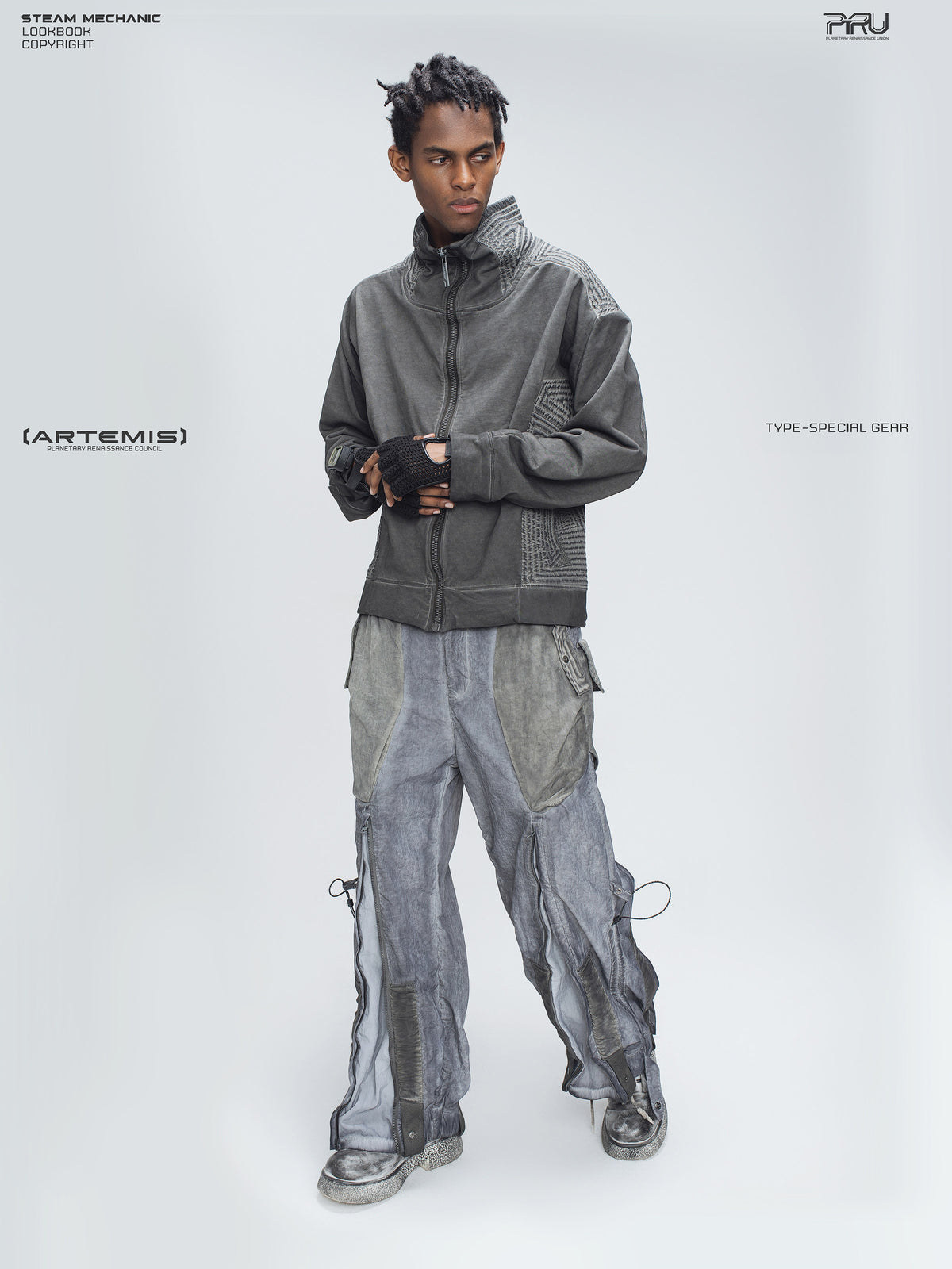 STARCORE moon dust gray engineer utility pants — full front modeled view with hands clasped