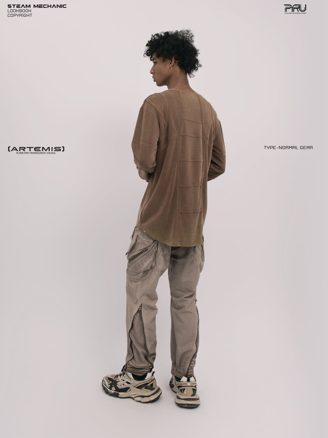 RUSTED ORBIT mesh-panel long-sleeve top — rear three-quarter modeled view showing the sleeve and side panels