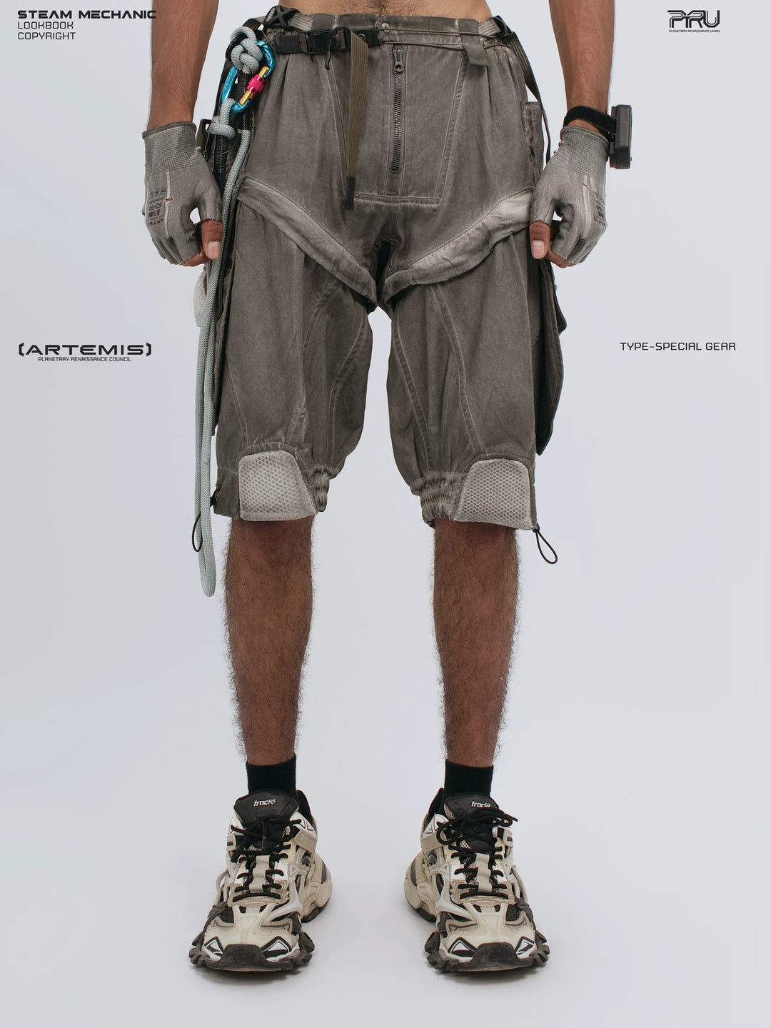 ARTEMIS xirang brown detachable technical shorts — front modeled view with both hands down