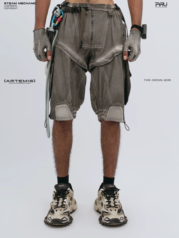 ARTEMIS xirang brown detachable technical shorts — front modeled view with both hands down