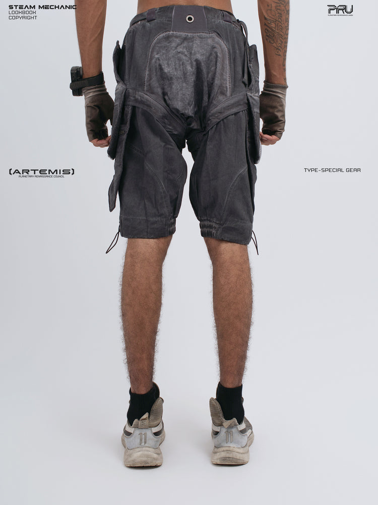 ARTEMIS stellar blue detachable technical shorts — rear modeled view with hands down