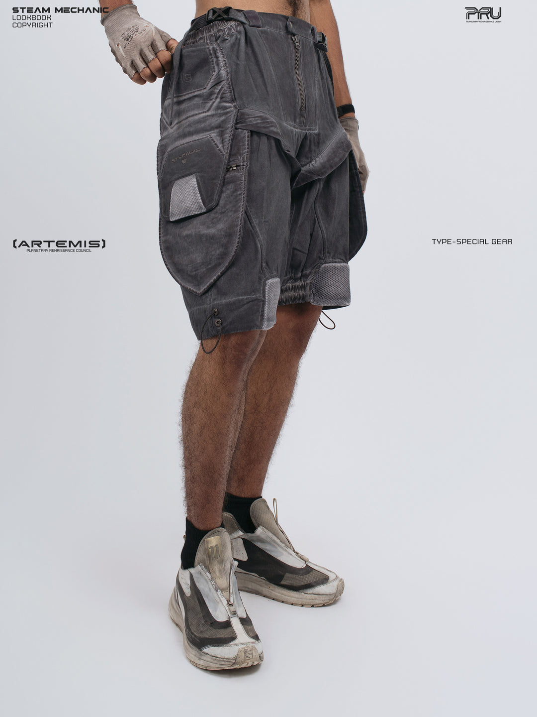 ARTEMIS stellar blue detachable technical shorts — three-quarter front view with right hand hooked in pocket
