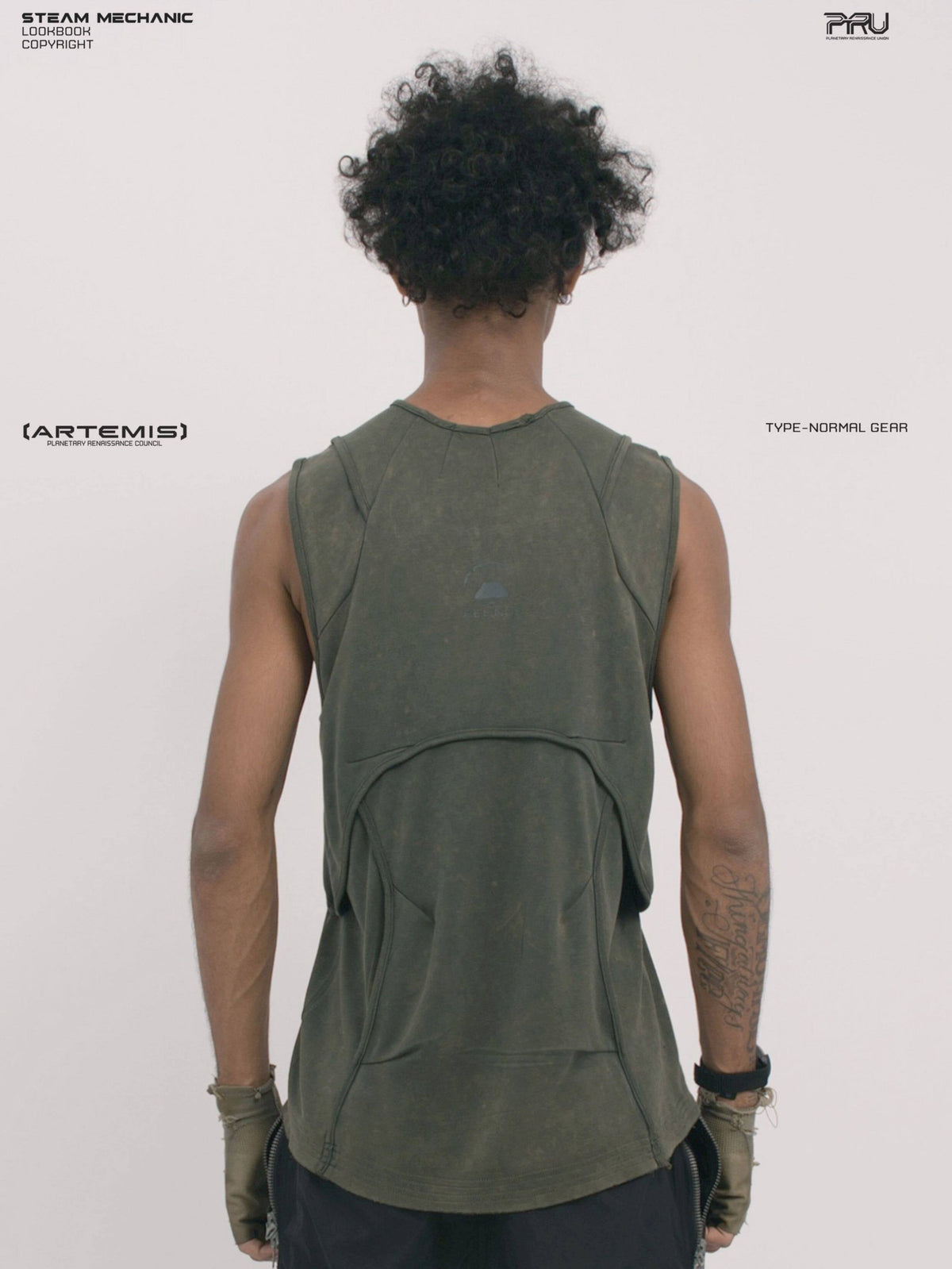 RIFT ARC moss green deconstructed tank — back modeled close-up showing curved rear panel and logo