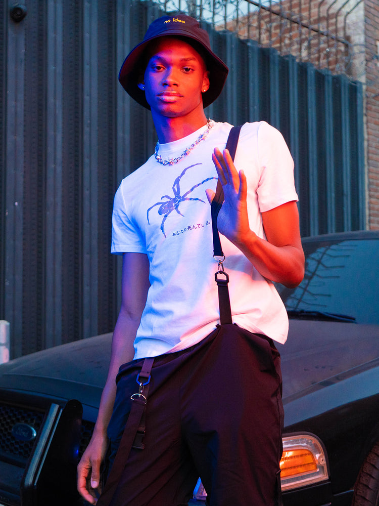 NO IDEA hat, black hat in a standing evening editorial portrait