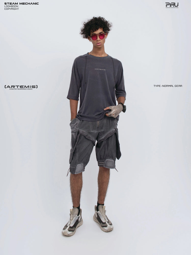 LIGHTSHADOW spirit deconstructed technical tee — full-length front view with one hand holding the hem