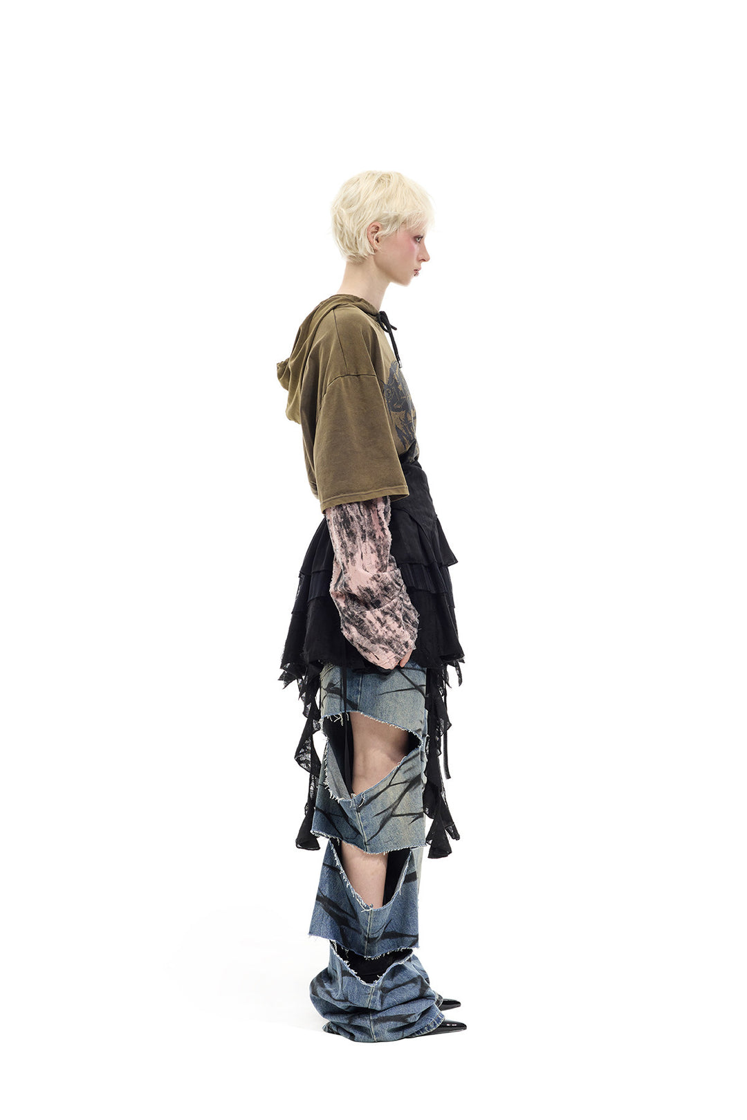PINKSPINK ELECTRIC MOON two-way layered lace mini dress — black dress worn as a skirt over jeans — full-length side view