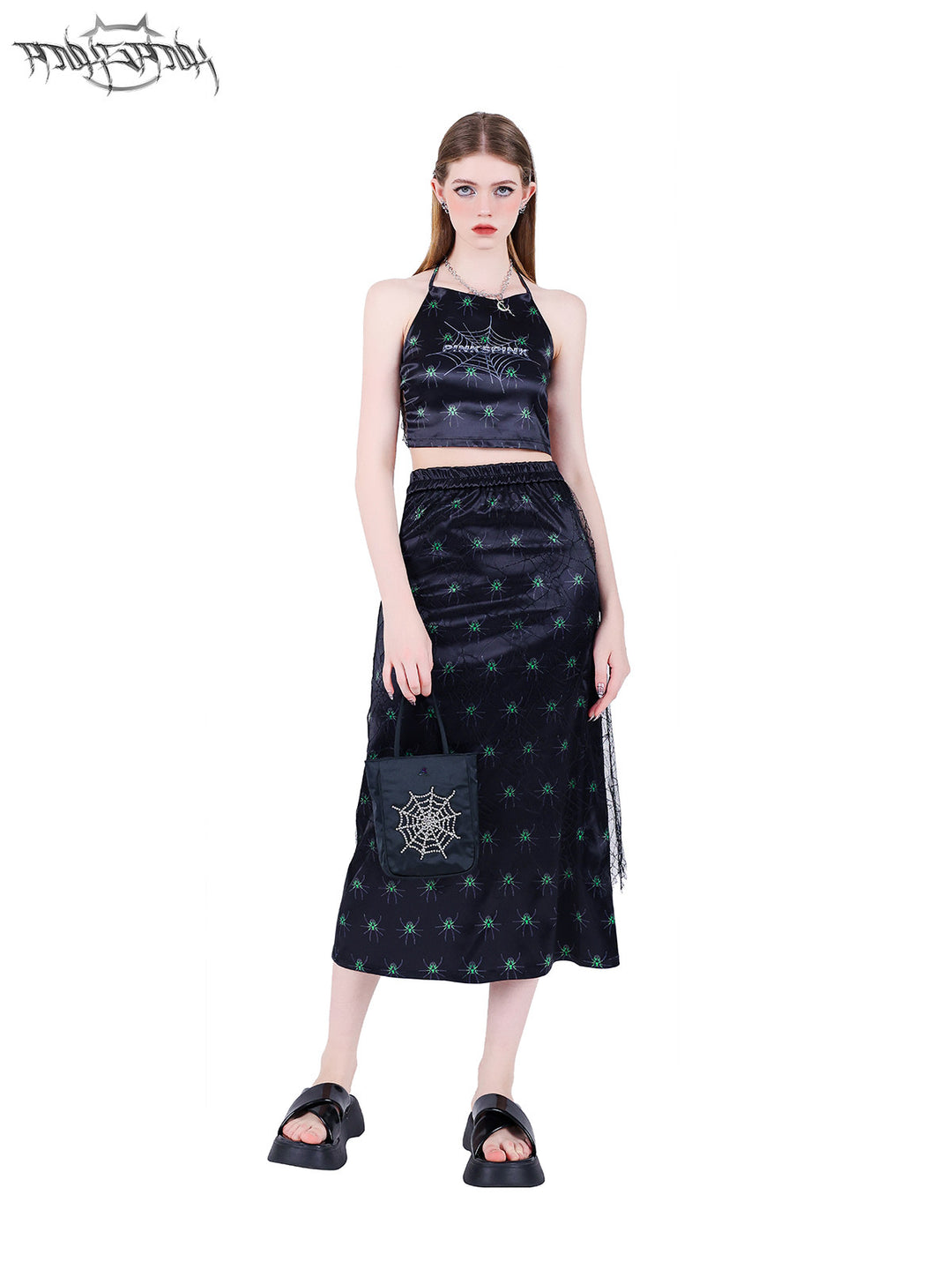 PINKSPINK SPIDER web-mesh halter crop top — front full-length modeled view holding a small web bag