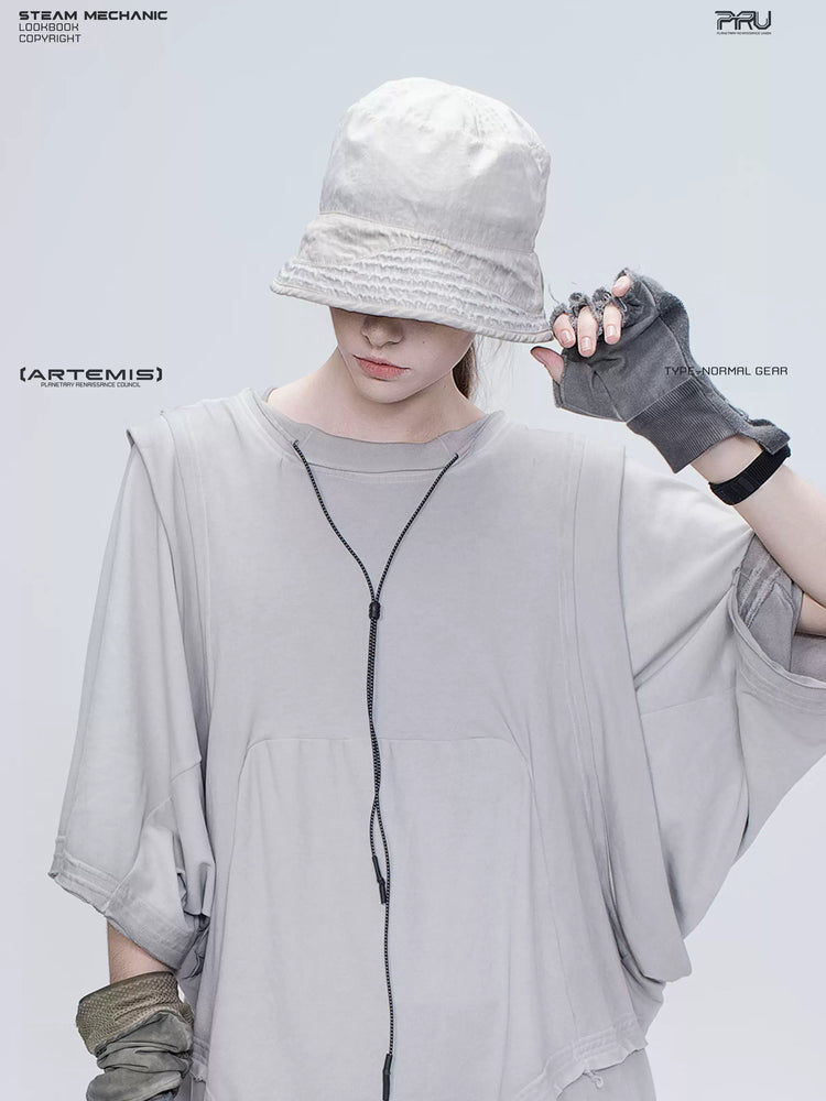 PIONEER eris white distressed nylon bucket hat — close-up with one hand holding the brim