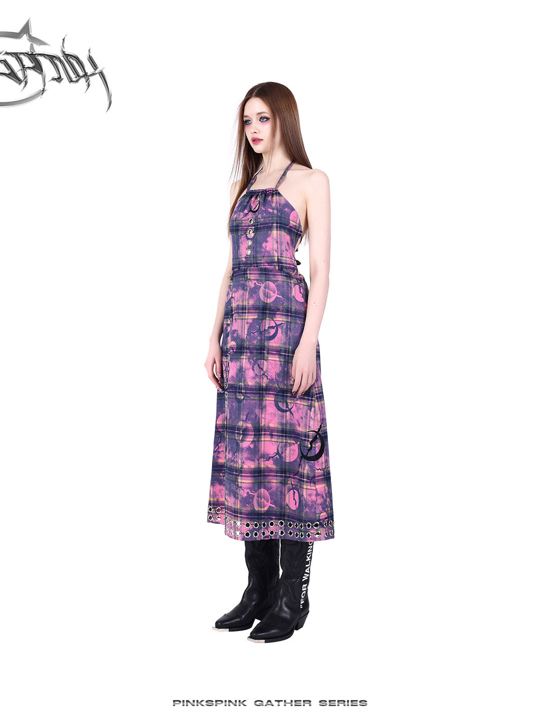 PINKSPINK WASTELAND eyelet plaid halter dress in pink purple — angled full-length modeled view with black boots