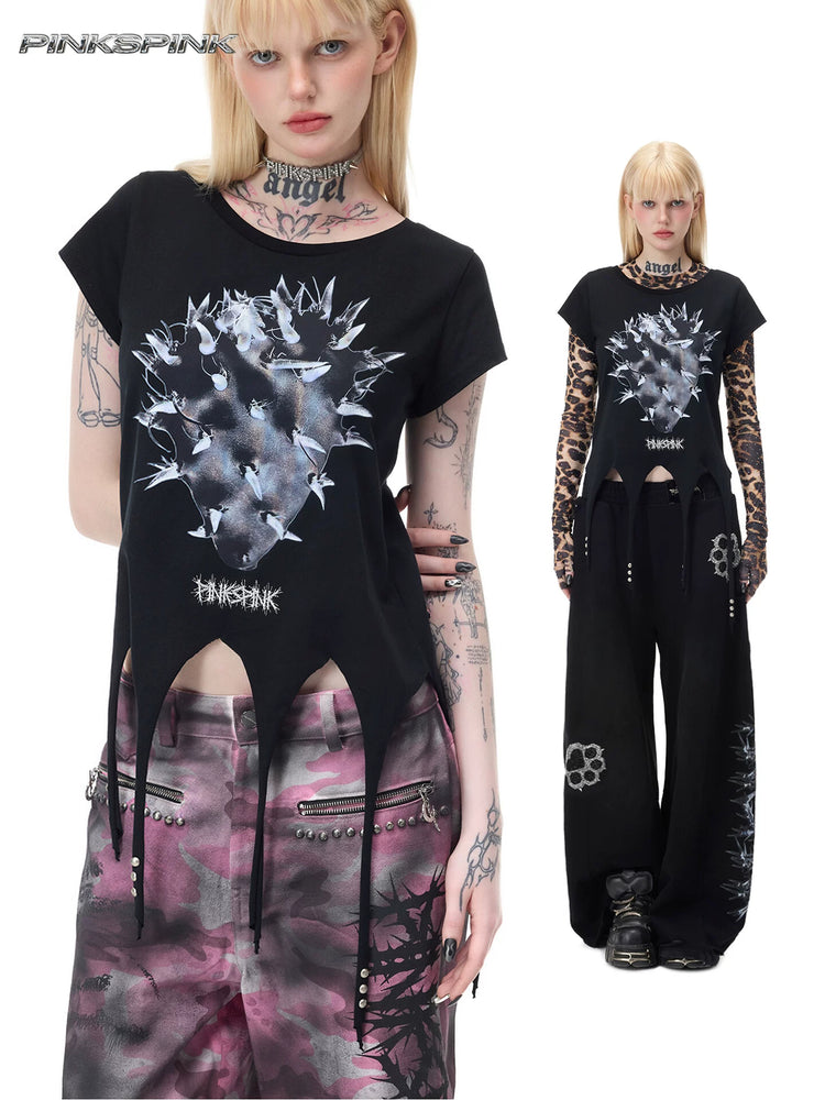 PINKSPINK PUNK CACTUS studded pointed-hem tee in black — collage of close front and full-length modeled views, including styling over a separate leopard mesh top