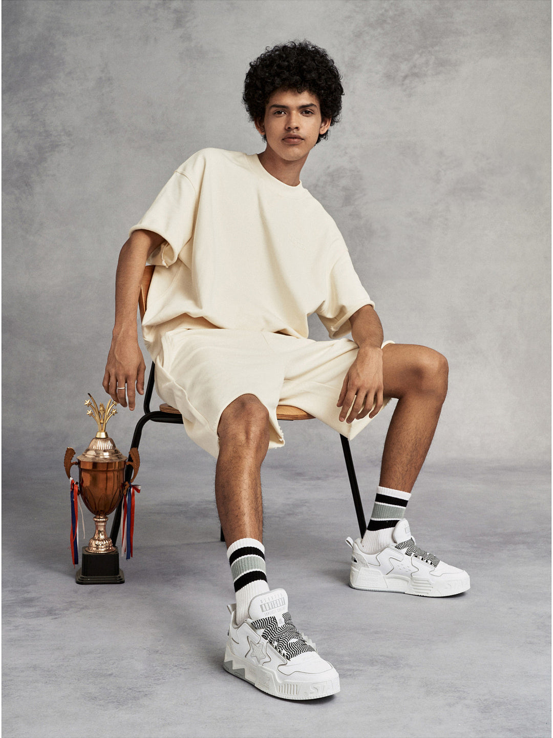 STARTER VOL-II White Gray sneakers styled in a full-body studio look, showing their padded low-top silhouette and molded platform soles