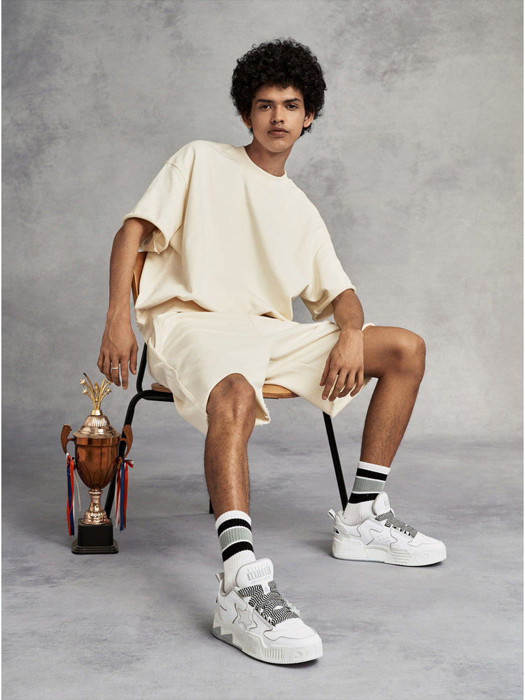STARTER VOL-II White Gray sneakers styled in a full-body studio look, showing their padded low-top silhouette and molded platform soles