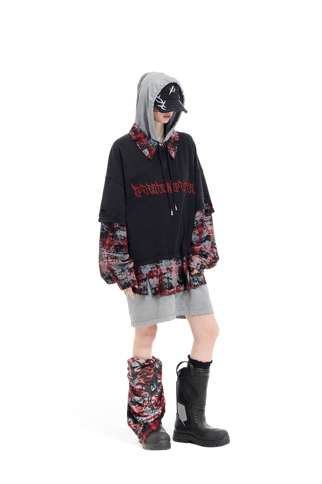 PINKSPINK REMAKE triple-layer plaid hoodie — black and red plaid hoodie — angled full-length view with hood framing face