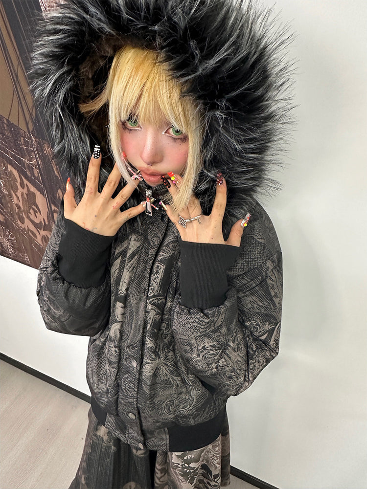 4RE1GN GOTHIC down jacket in charcoal ornamental print — Indoor hood-up modeled close-up with hands near the face.