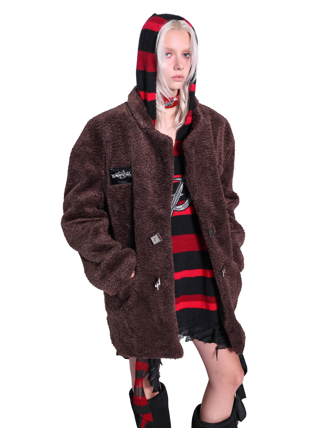 PINKSPINK ELECTRIC MOON striped hooded sweater in BLACK AND RED — close layered styling showing hood above brown coat.